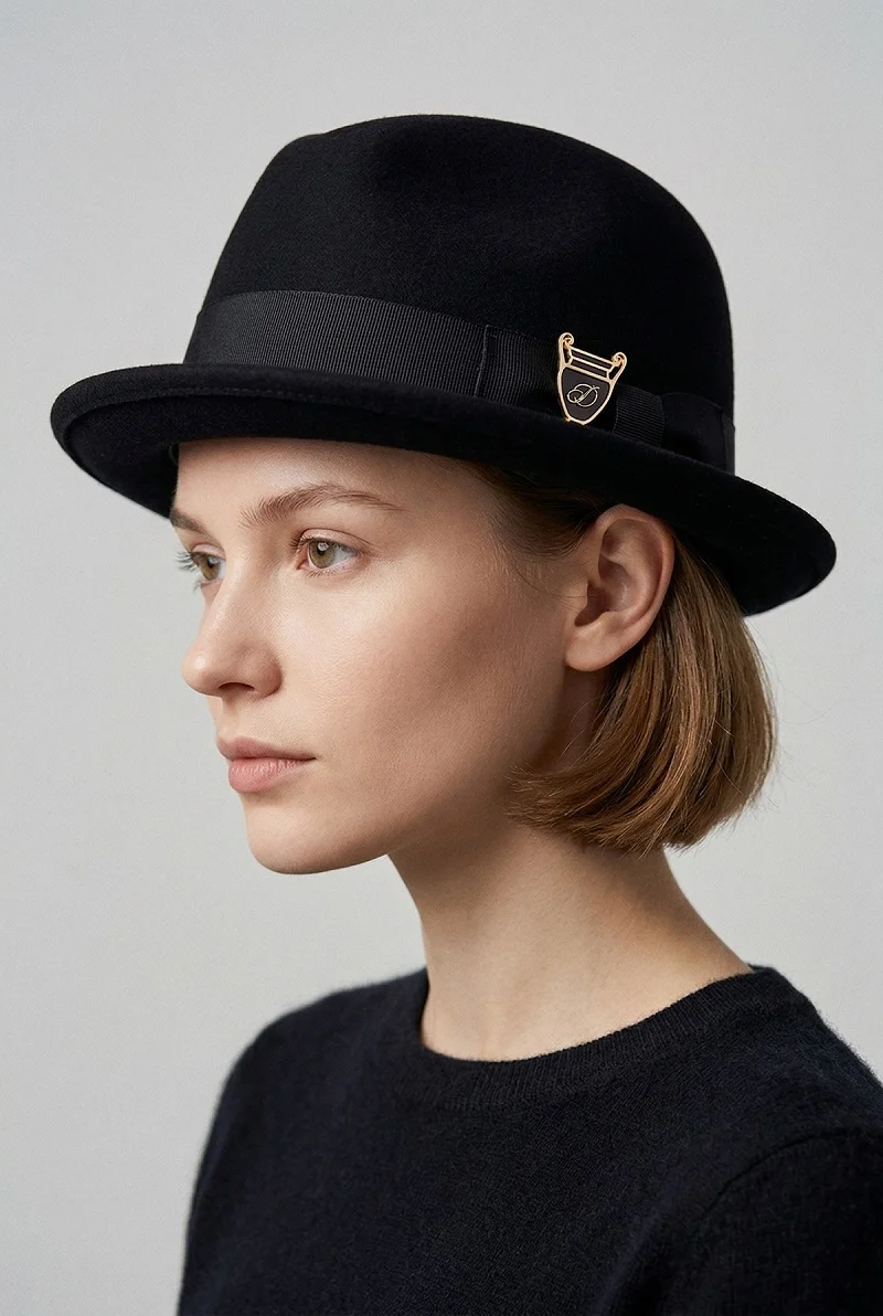 Gold Crest Brooch on Hat