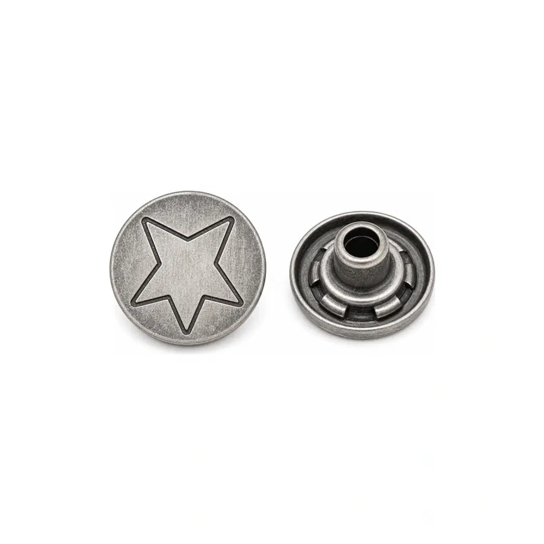 Weathered silver star jeans button shown from the front and back